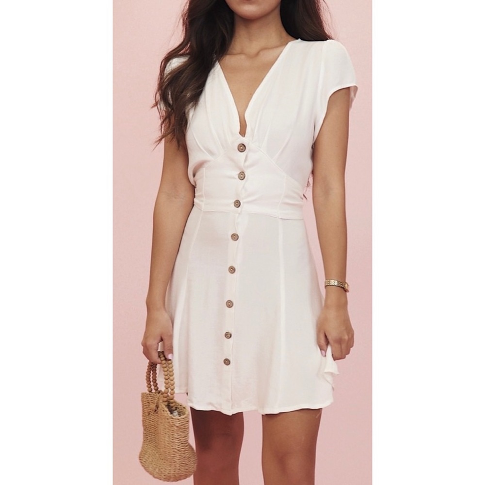 NWT White button up v-neck dress with ties. Size Medium. Brand : Crybaby